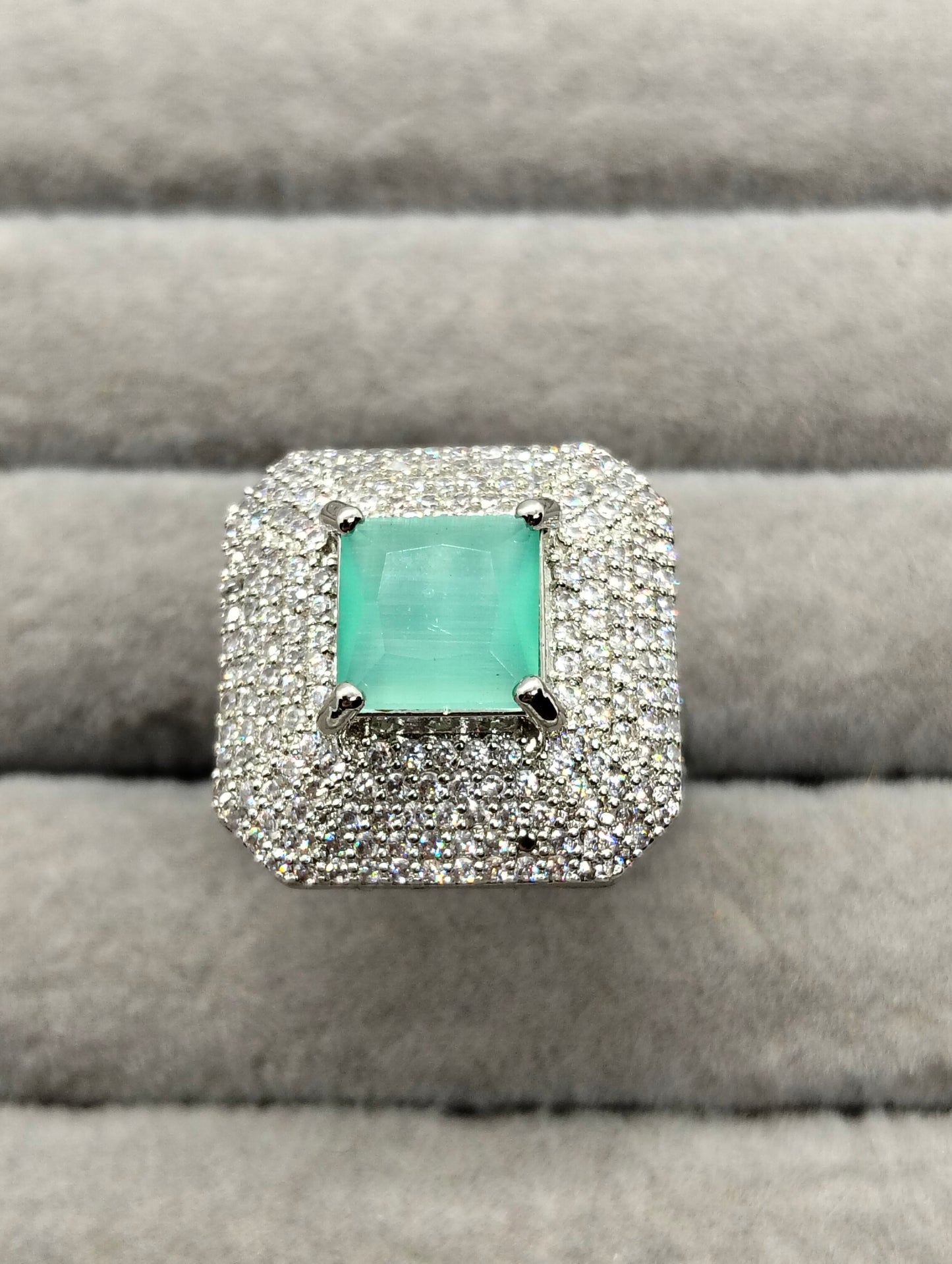 One carat silver rhodium plated ring in mint green stone adjustable