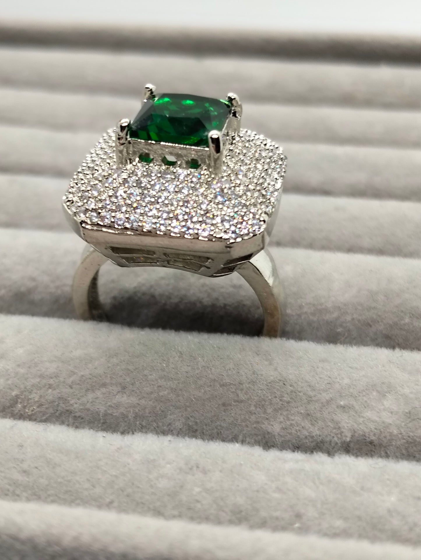 One carat silver rhodium plated ring in green stone