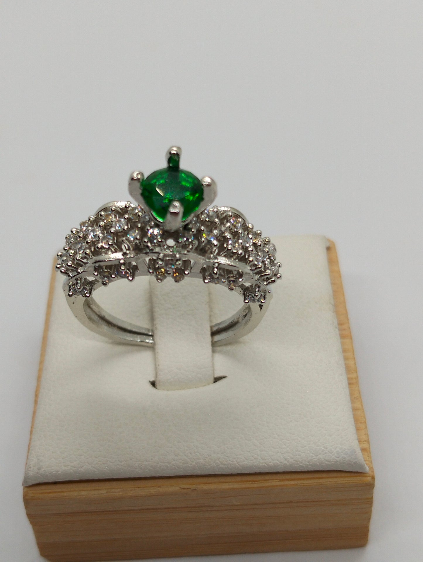 Silver rhodium plated crown ring in green stone
