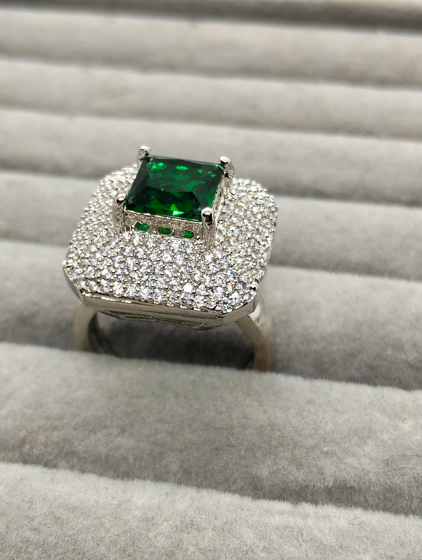 One carat silver rhodium plated ring in green stone