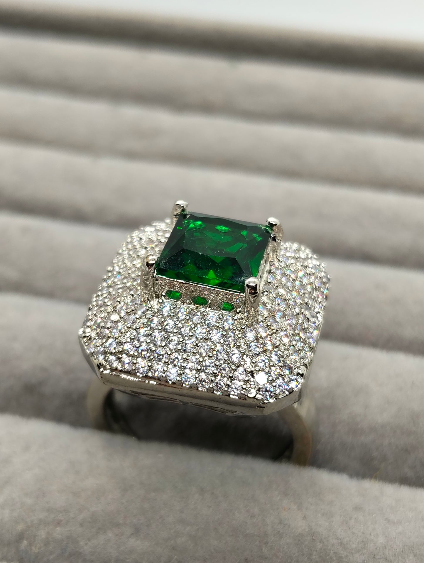 One carat silver rhodium plated ring in green stone