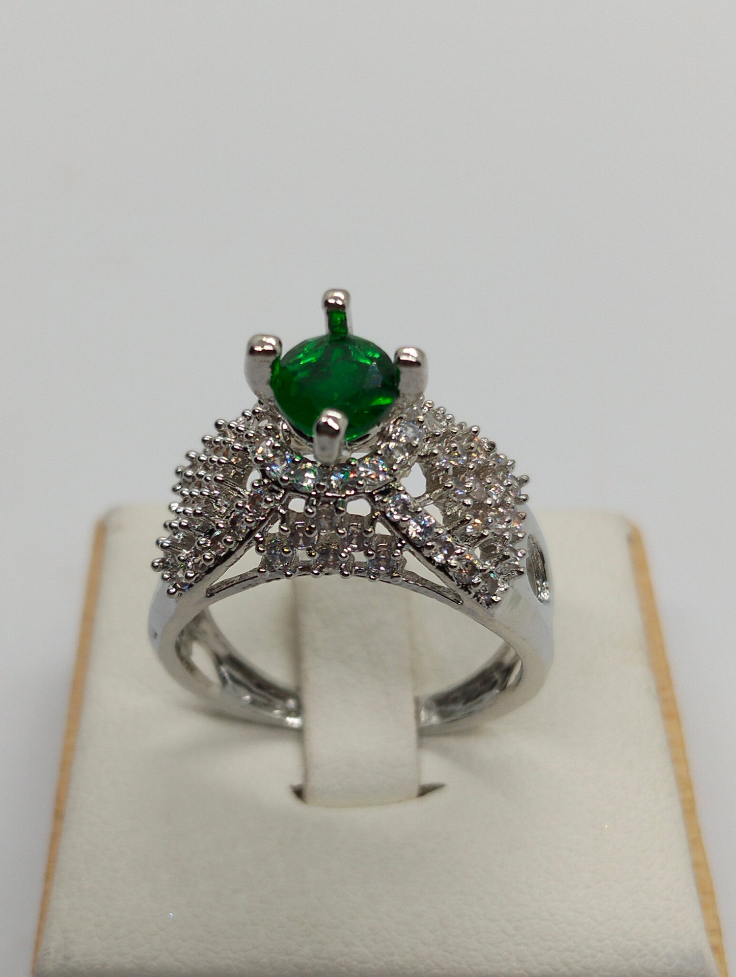 Silver rhodium plated ring in green stone