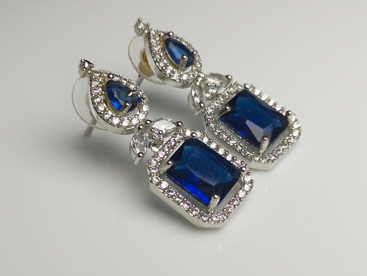 Royal Blue Gemstone Halo Earrings in Rhodium Plated Silver