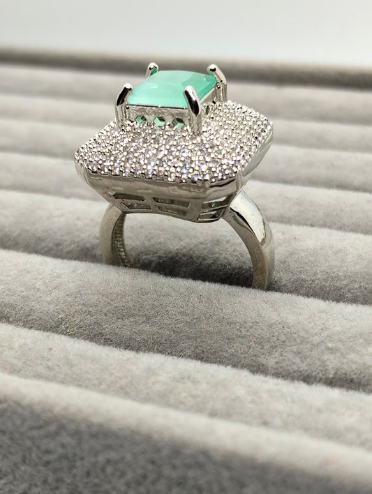 One carat silver rhodium plated ring in mint green stone adjustable