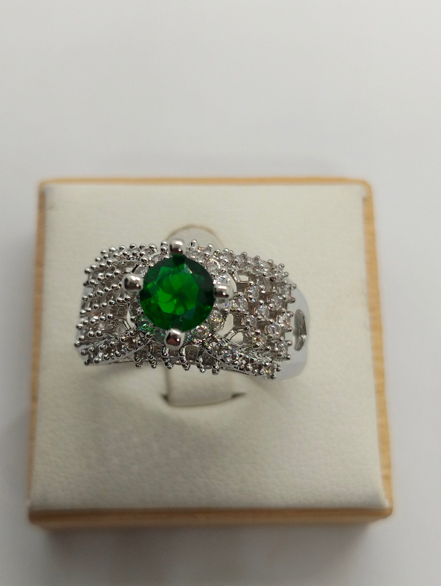 Silver rhodium plated ring in green stone
