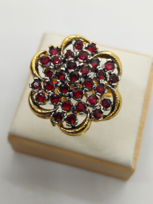 Red stone adjustable ring in casting